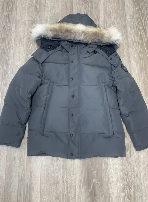 Grey parka black badge